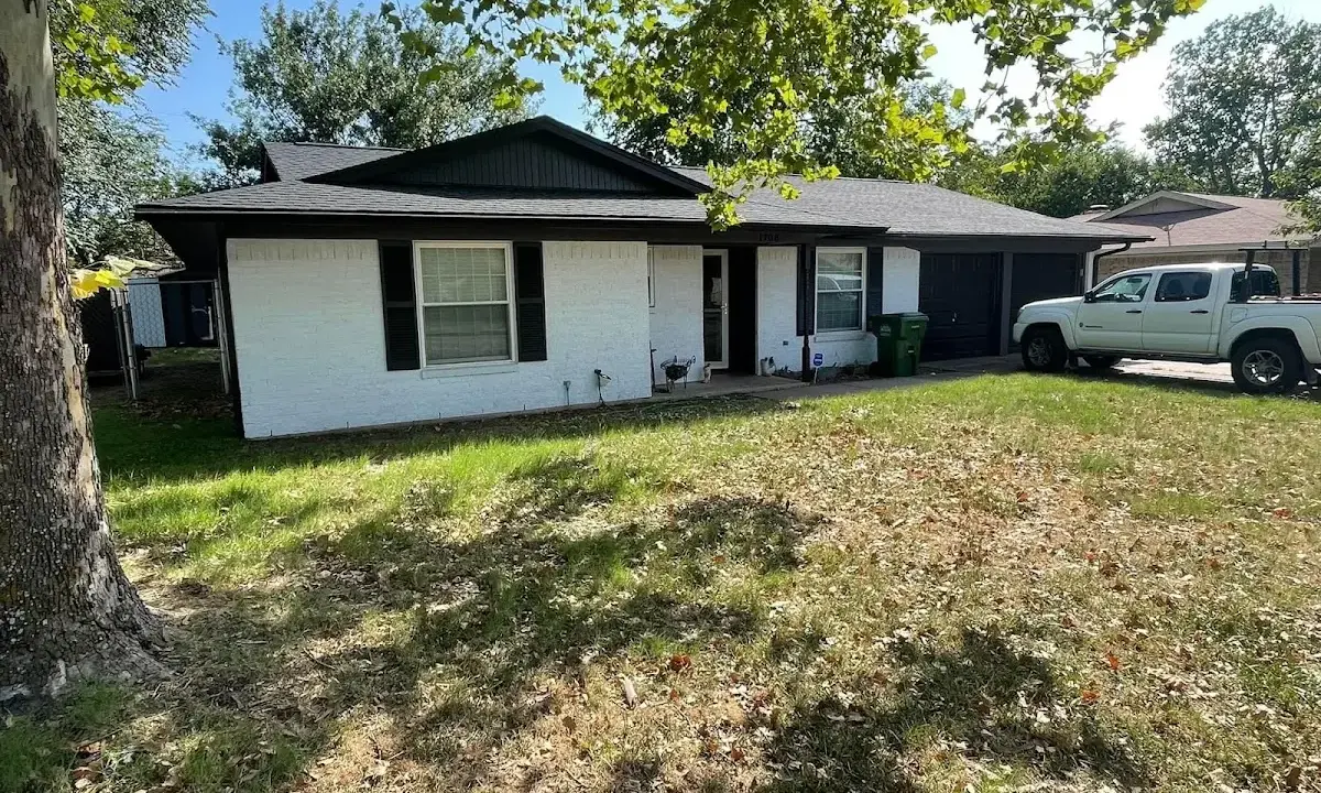 Professional roofing crew working on a residential roof in Columbus